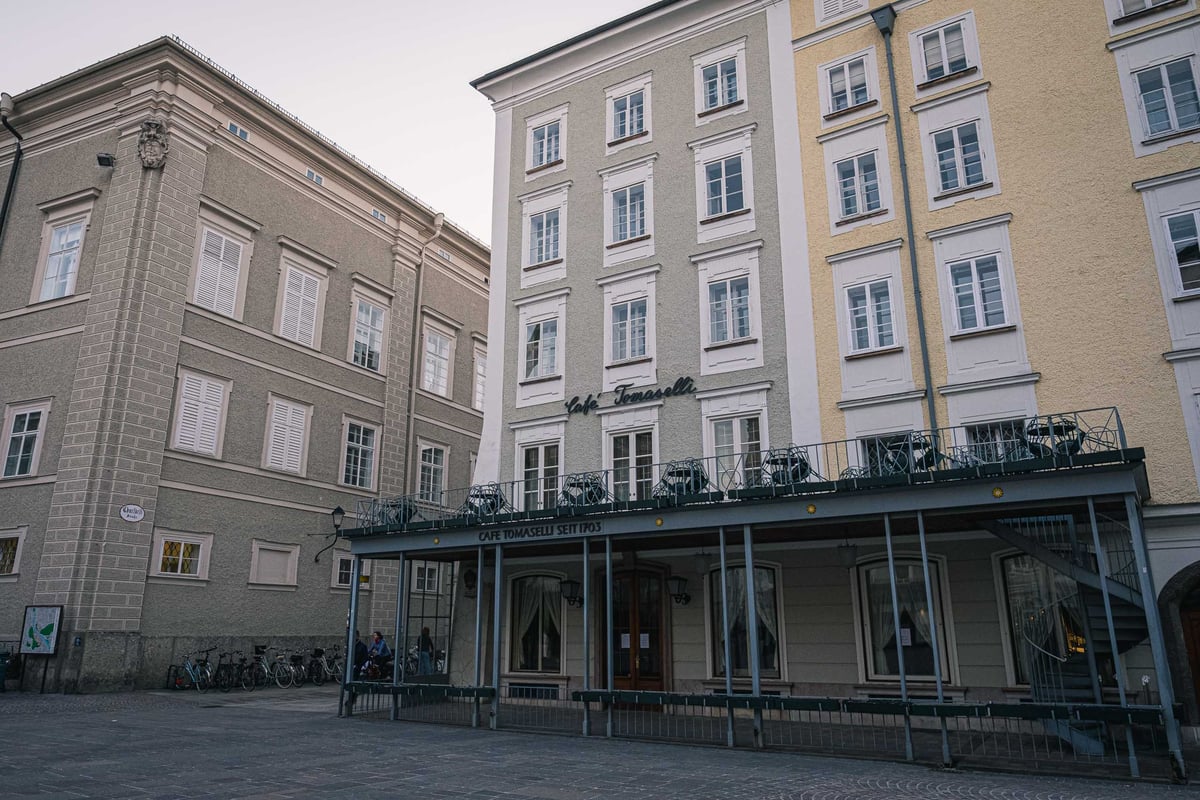 Cafe Tomaselli covered terrace on Alter Markt square in Salzburg old town.