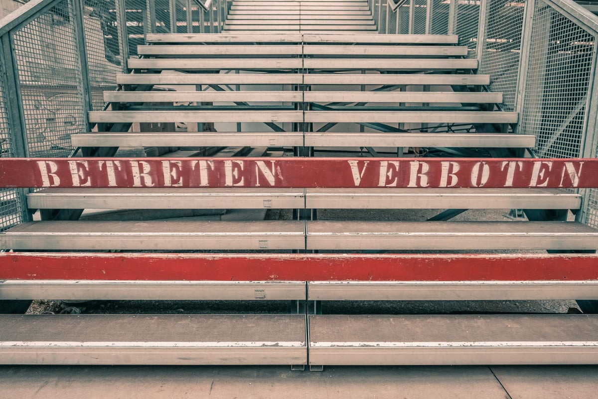 Industrial metal scaffolding stairs of the Jedermann grandstand with red Betreten Verboten sign at the Salzburg Festival in the Altstadt