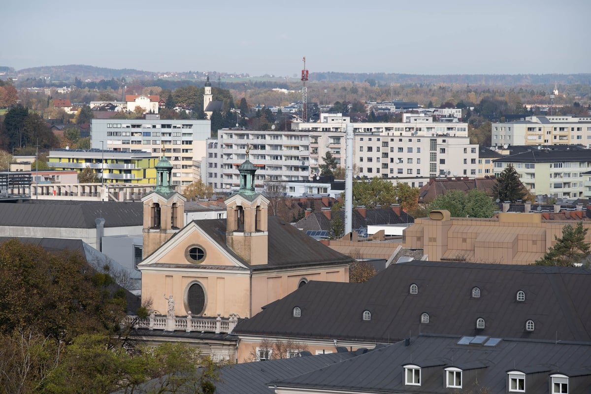 Johannesspital Church viewed from afar across the Salzburg cityscape
