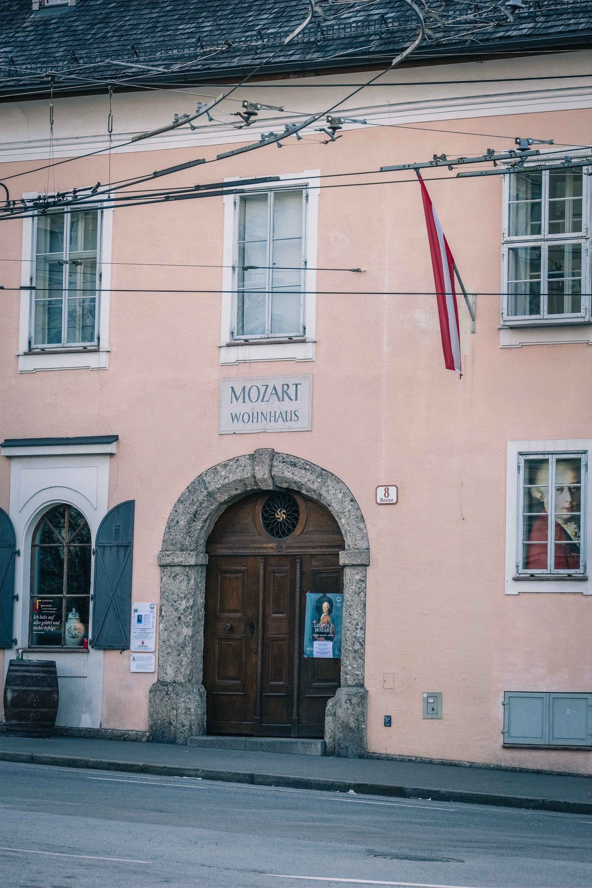 Pink facade of Mozart Wohnhaus with Mozart Residence sign in Salzburg