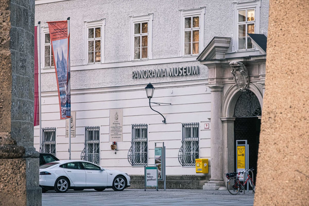 Entrance and banner of the Panorama Museum on Residenzplatz in Salzburg old town.