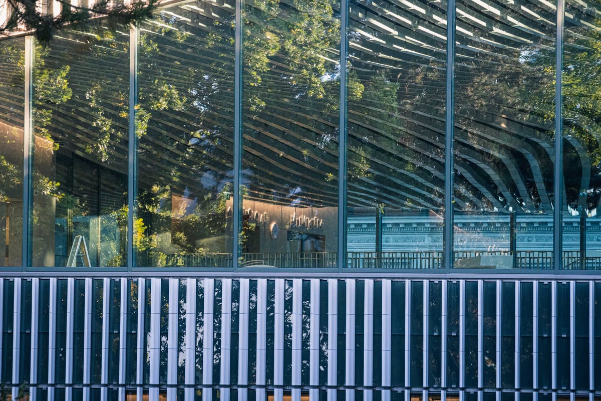 The Paracelsus Bad in Salzburg with its modern glass curtain wall etched with an organic vegetal pattern
