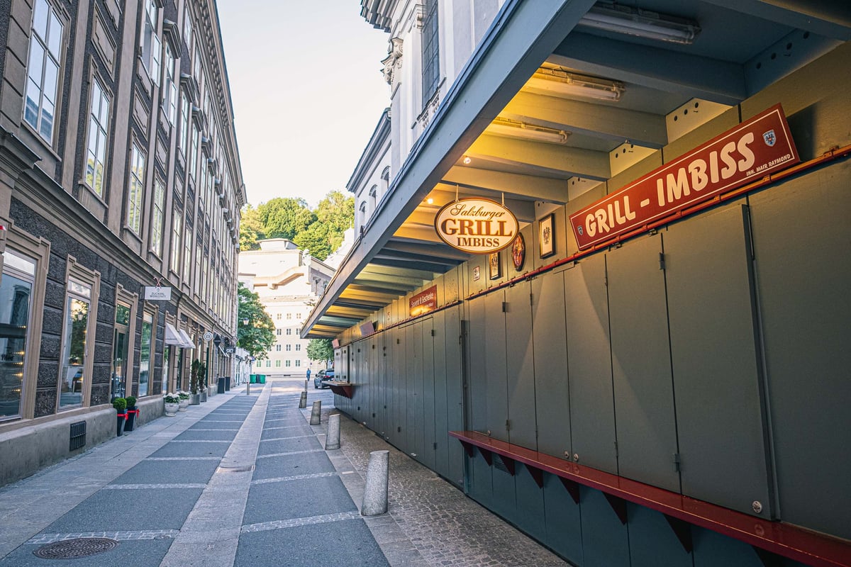 Salzburger Grill Imbiss street food stand on empty alley in Salzburg old town.