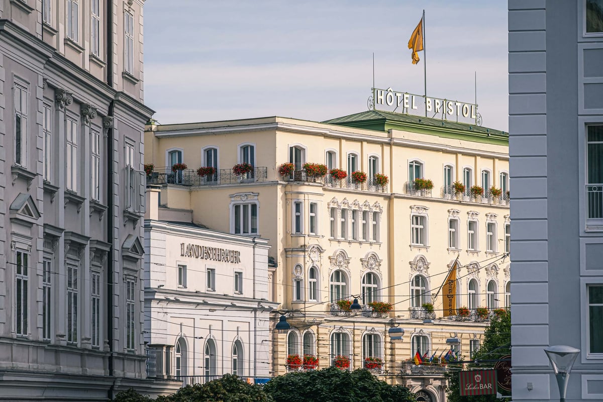 Salzburger Landestheater facade next to Hotel Bristol on Makartplatz in Salzburg.