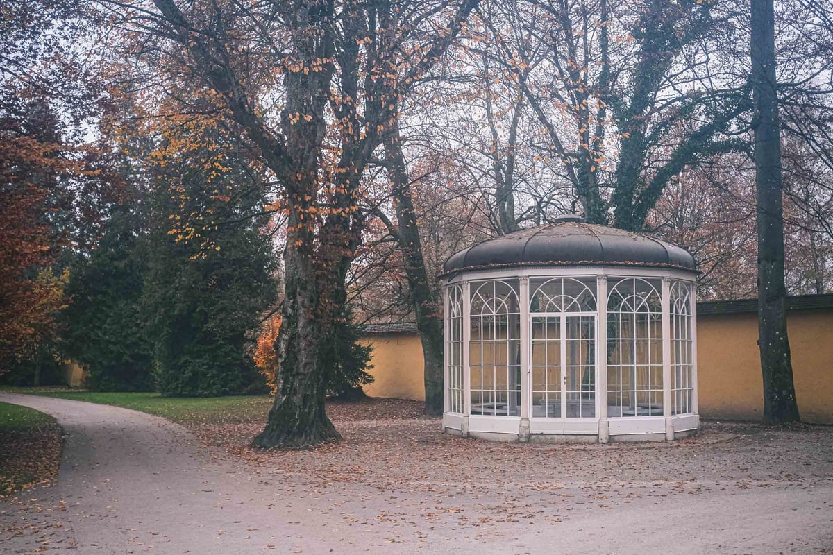 The Sound of Music Pavilion stands among bare autumn trees in Hellbrunn gardens in Salzburg.