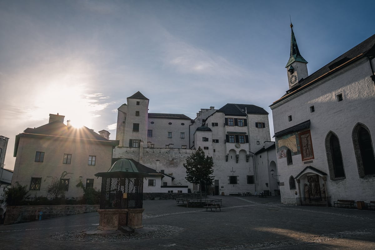 Saint George chapel clock tower with sundial in Hohensalzburg fortress courtyard in Salzburg
