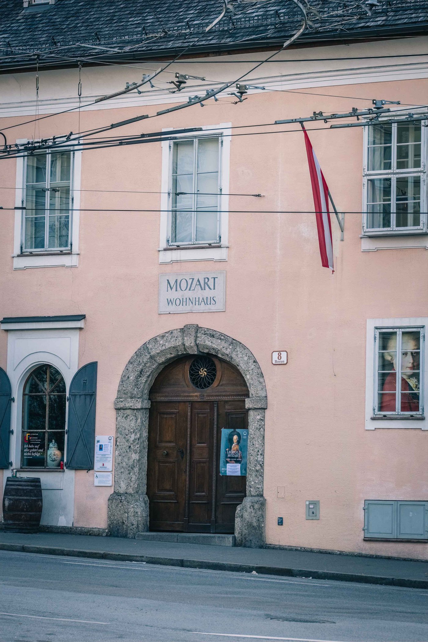 Pink facade of Mozart Wohnhaus with Mozart Residence sign in Salzburg