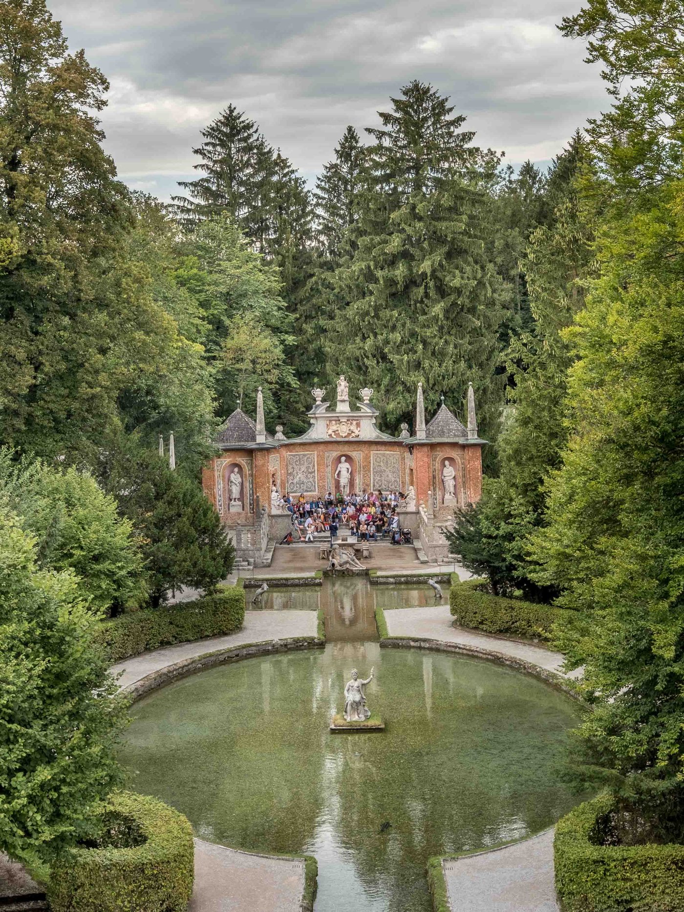 Roman Theatre trick fountain with water pond and hedge garden at Hellbrunn in Salzburg