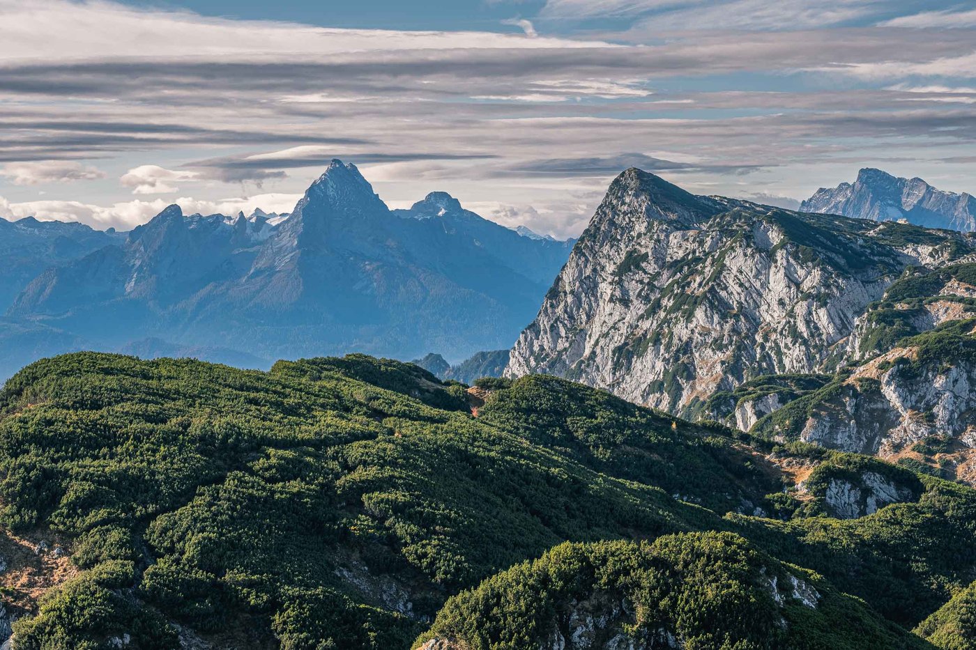 Watzmann massif silhouetted against clouds seen from a ridge near Salzburg.