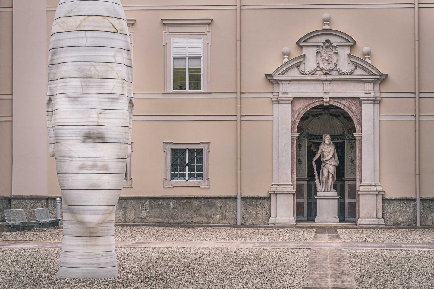 Jaume Plensa Awilda marble head beside Mirabell Palace entrance in Salzburg.