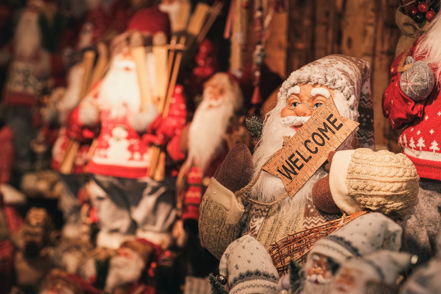 Vintage-style Santa Claus figurines on display at a Christmas market stall in Salzburg.