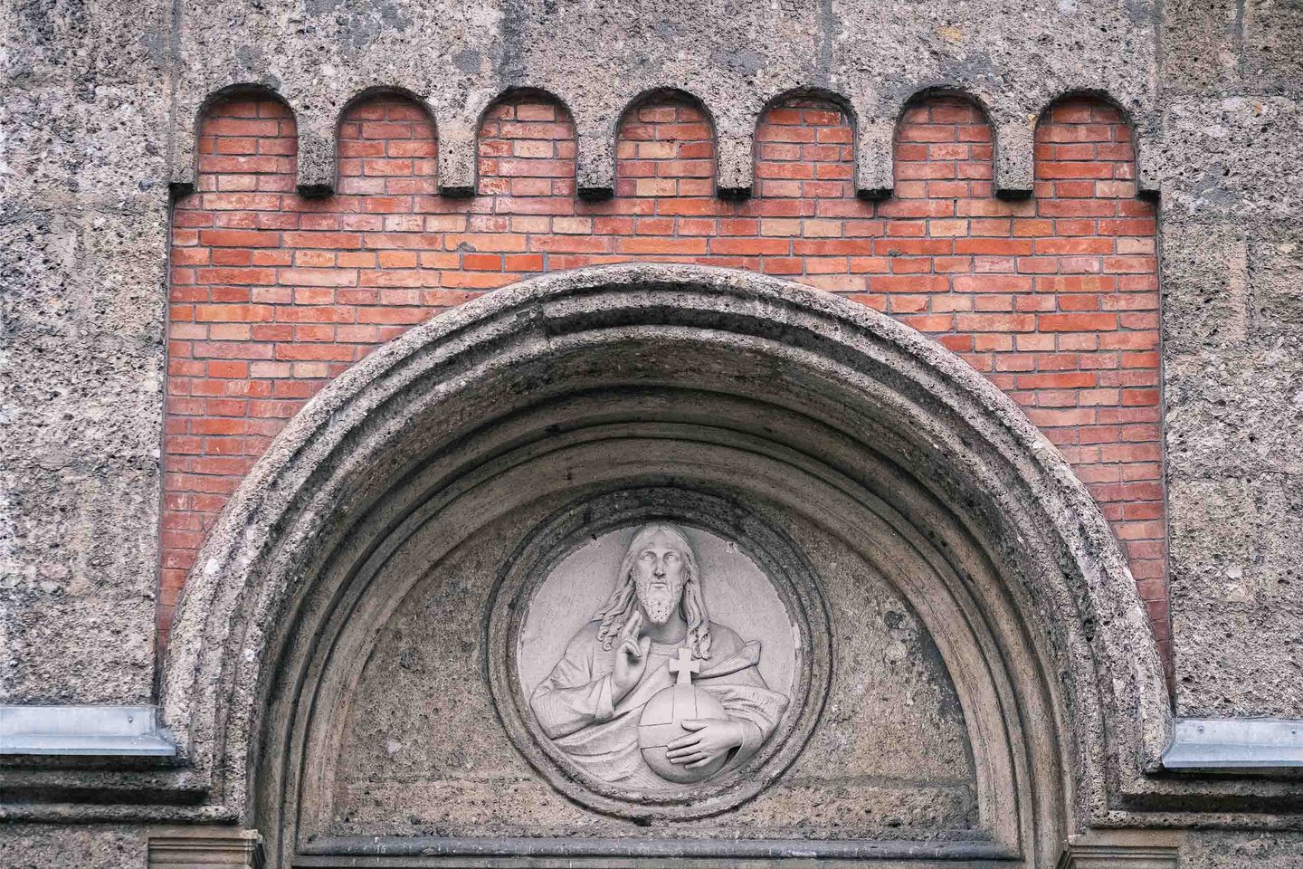 Christ relief medallion above the Christuskirche portal in Salzburg