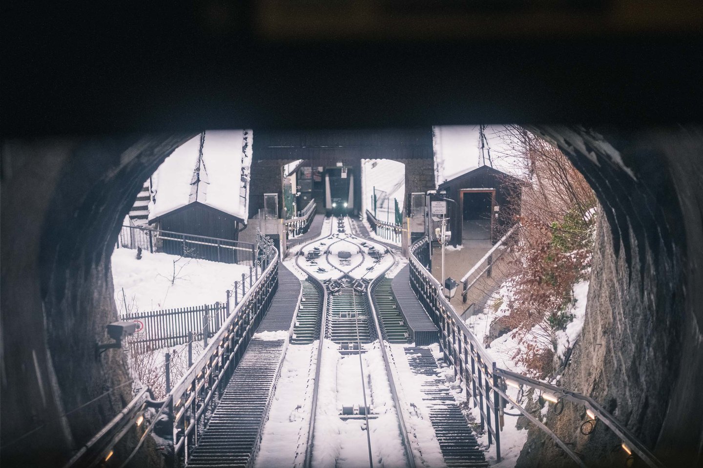 Snowy tracks of the Festungsbahn funicular leading up to Hohensalzburg Fortress in Salzburg.