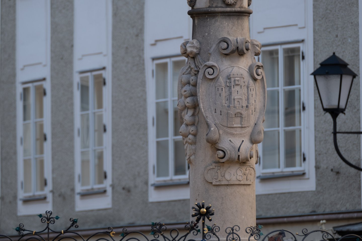 Salzburg coat of arms carved into the Florianibrunnen fountain column dated 1687 on Alter Markt.