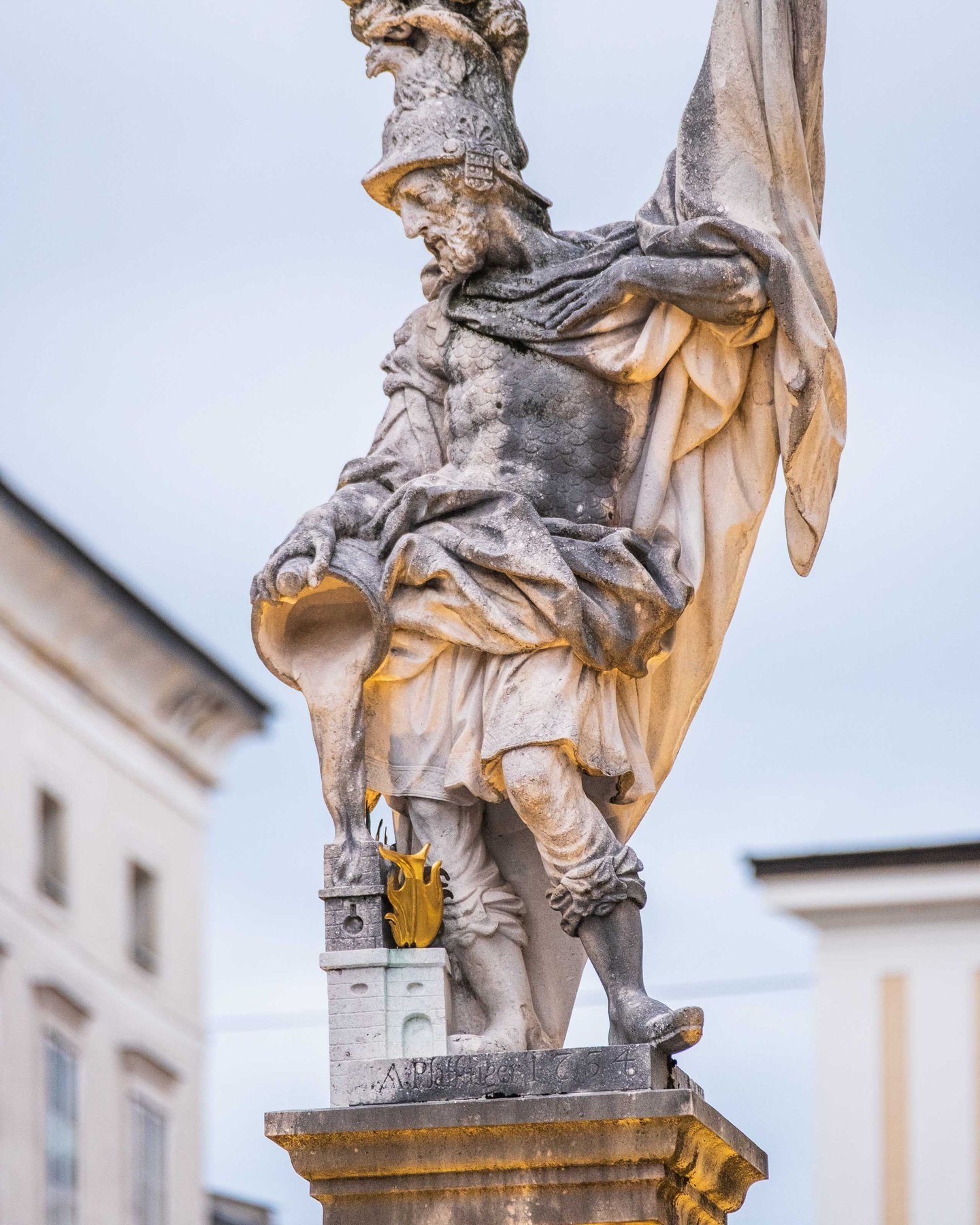 Tighter view of Saint Florian statue on top of the Florianibrunnen on Alter Markt in Salzburg