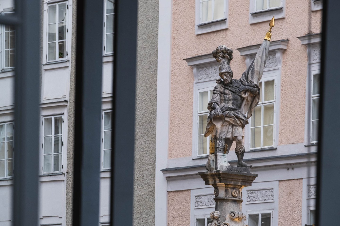 Saint Florian statue atop the Florianibrunnen column on Alter Markt in Salzburg old town
