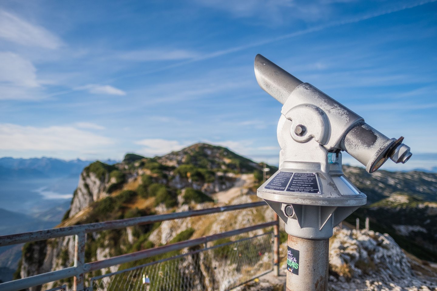 Viewing telescope on the Geiereck summit with the Salzburger Hochthron ridge behind on the Untersberg.