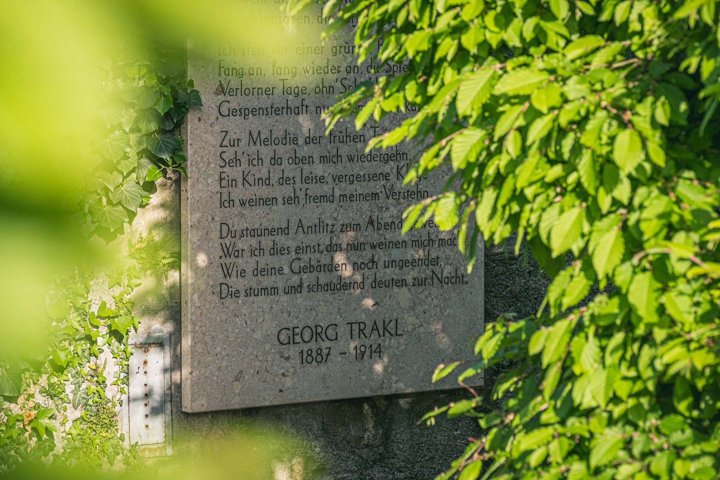 Close view of the Georg Trakl Naturtheater plaque dated 1887 to 1914 in Salzburg.
