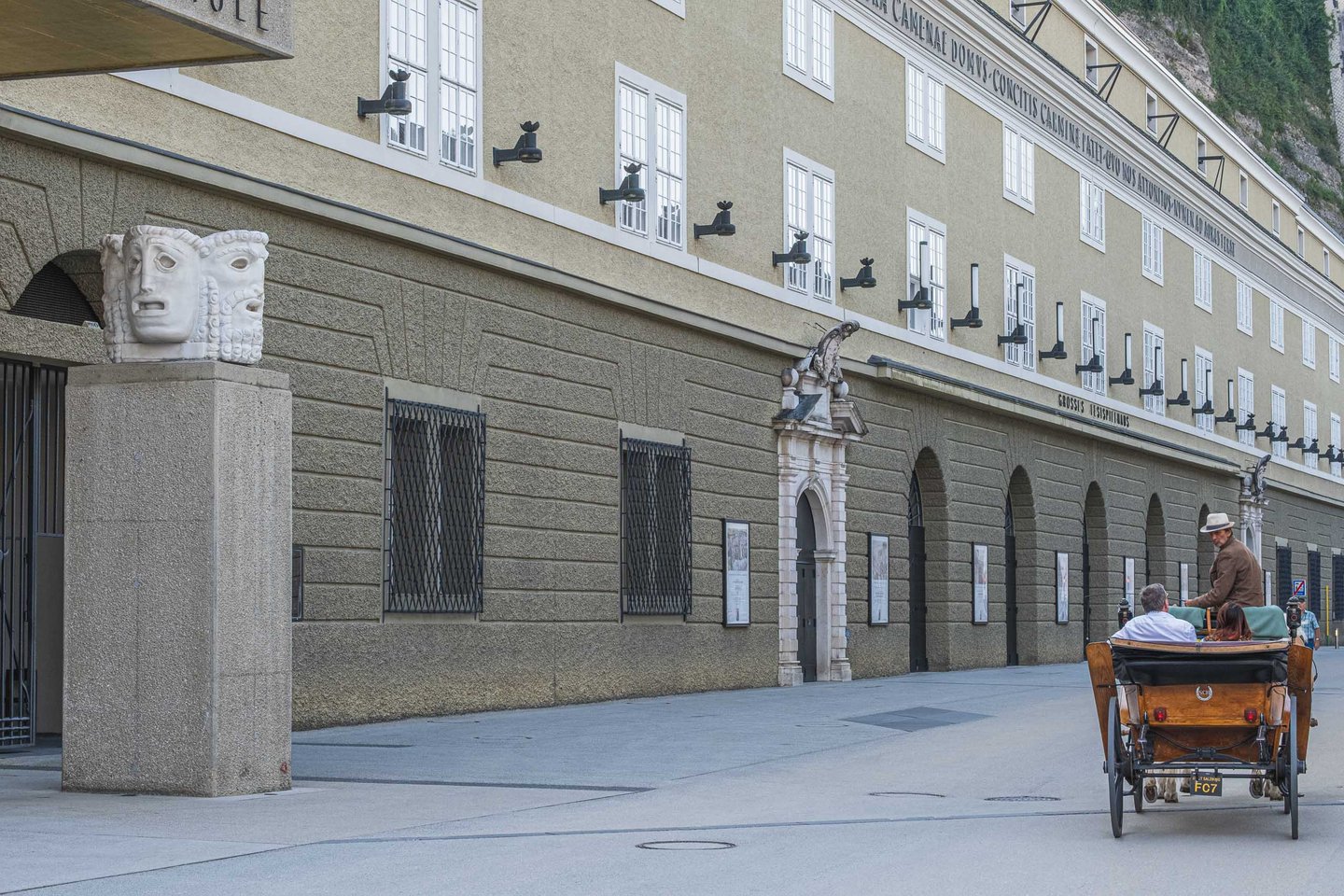 Festspielhaus facade with Karajan stone mask sculpture on Hofstallgasse in Salzburg