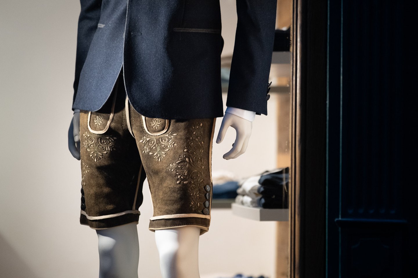Embroidered leather Lederhosen on a mannequin in a traditional dirndl and tracht shop in Salzburg