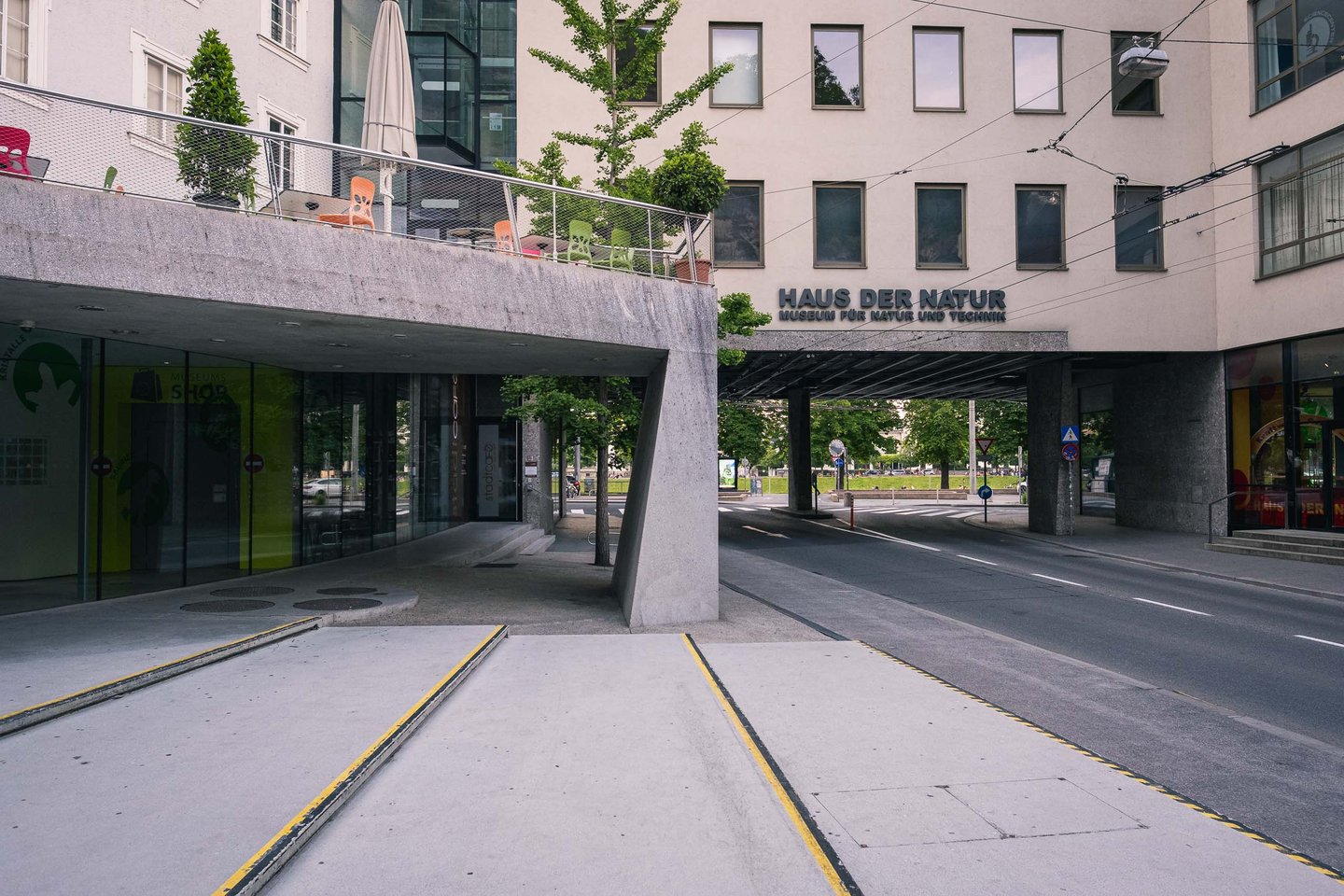 Haus der Natur museum seen from street with signage above concrete canopy in Salzburg