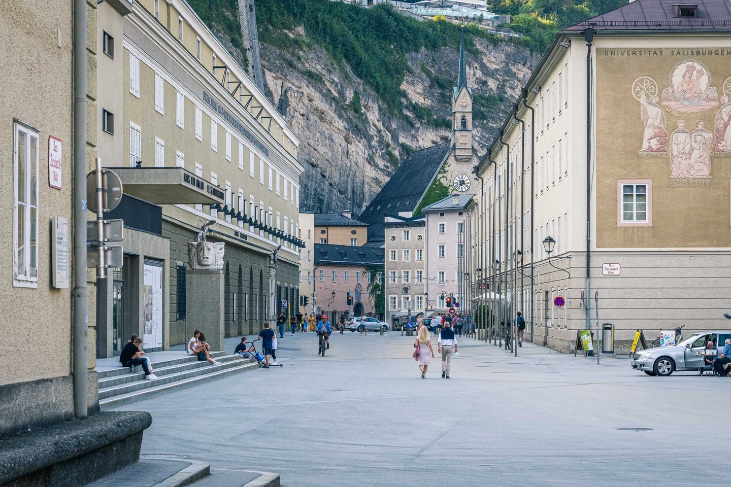 Hofstallgasse looking toward Universitaetsplatz with Kollegienkirche spire in Salzburg