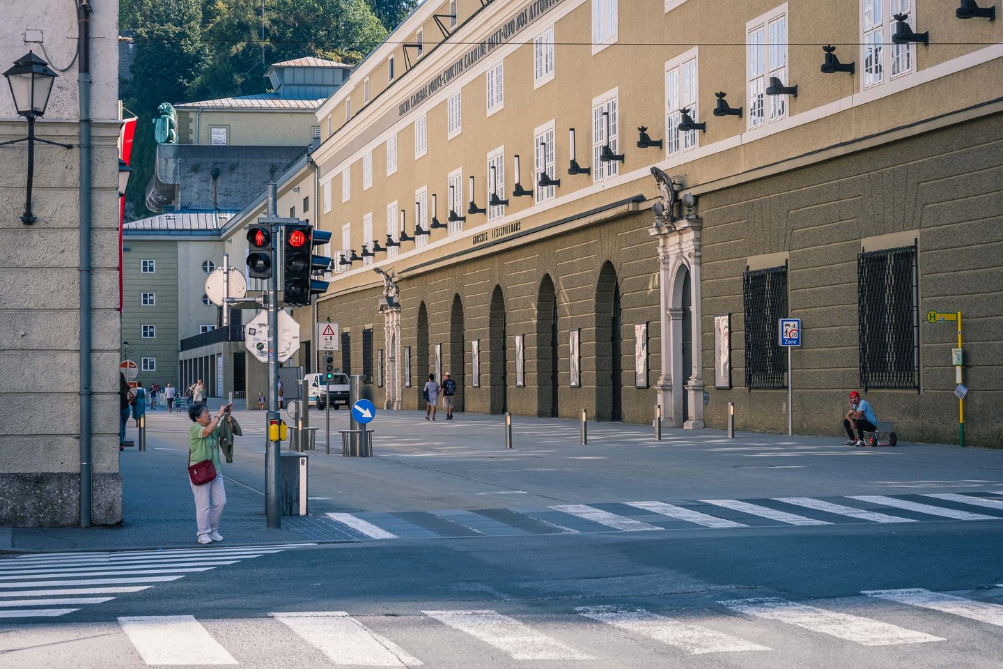 Hofstallgasse with former court stables facade and horse sculptures beside Felsenreitschule in Salzburg