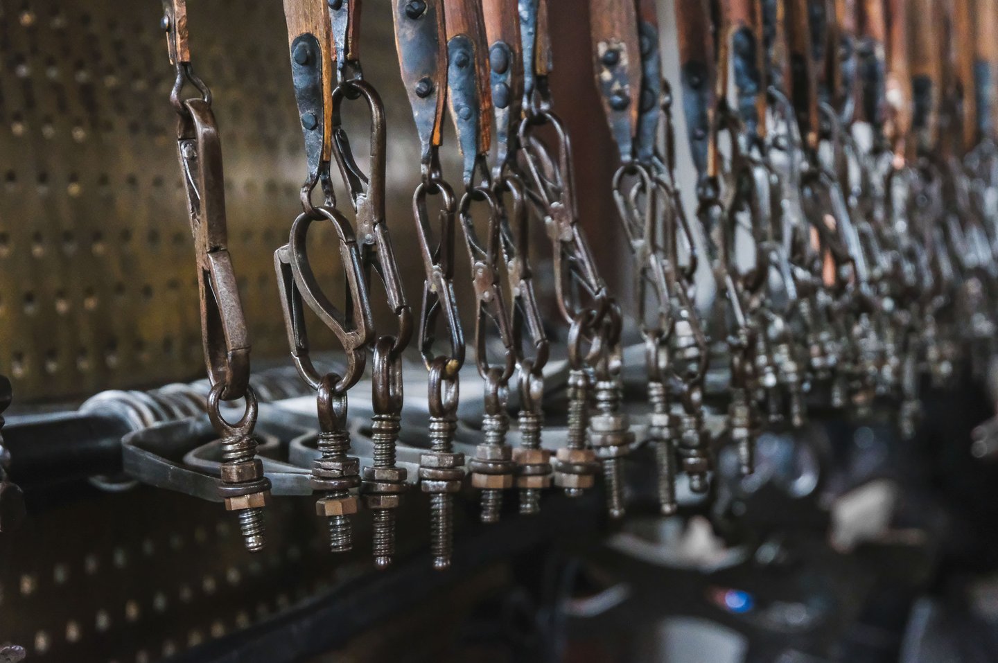 Close-up of historic mechanical organ stops and pipework inside Hohensalzburg Fortress in Salzburg