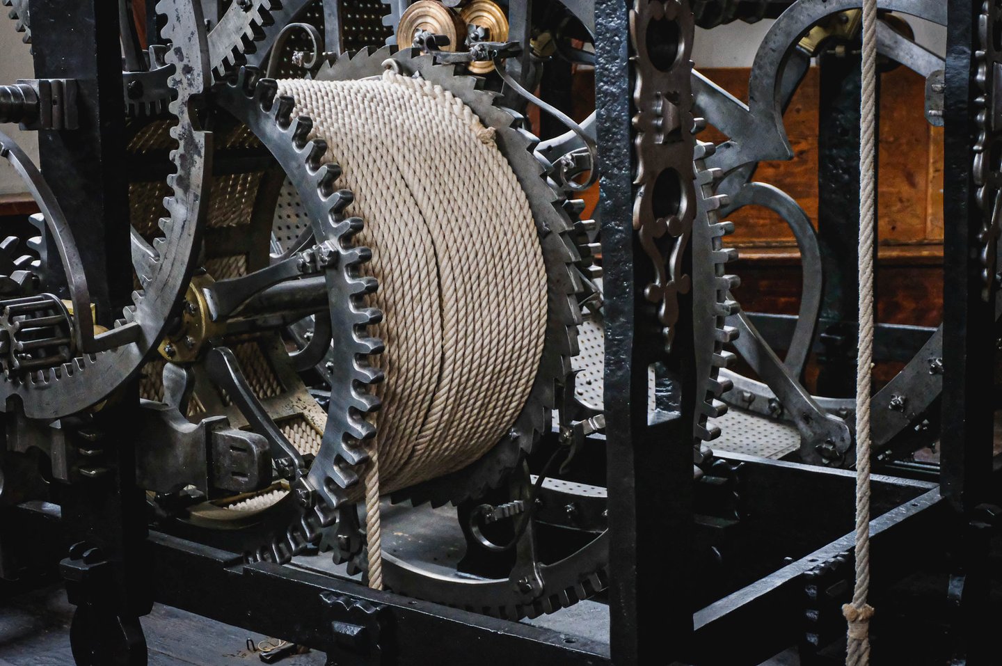 Historic wooden and iron windlass mechanism with rope drum inside Hohensalzburg Fortress in Salzburg