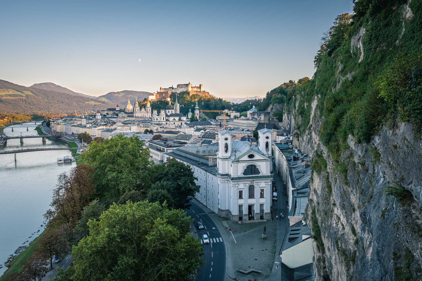 Panorama from Humboldt Terrace over Salzach river with Markuskirche and Hohensalzburg fortress in Salzburg