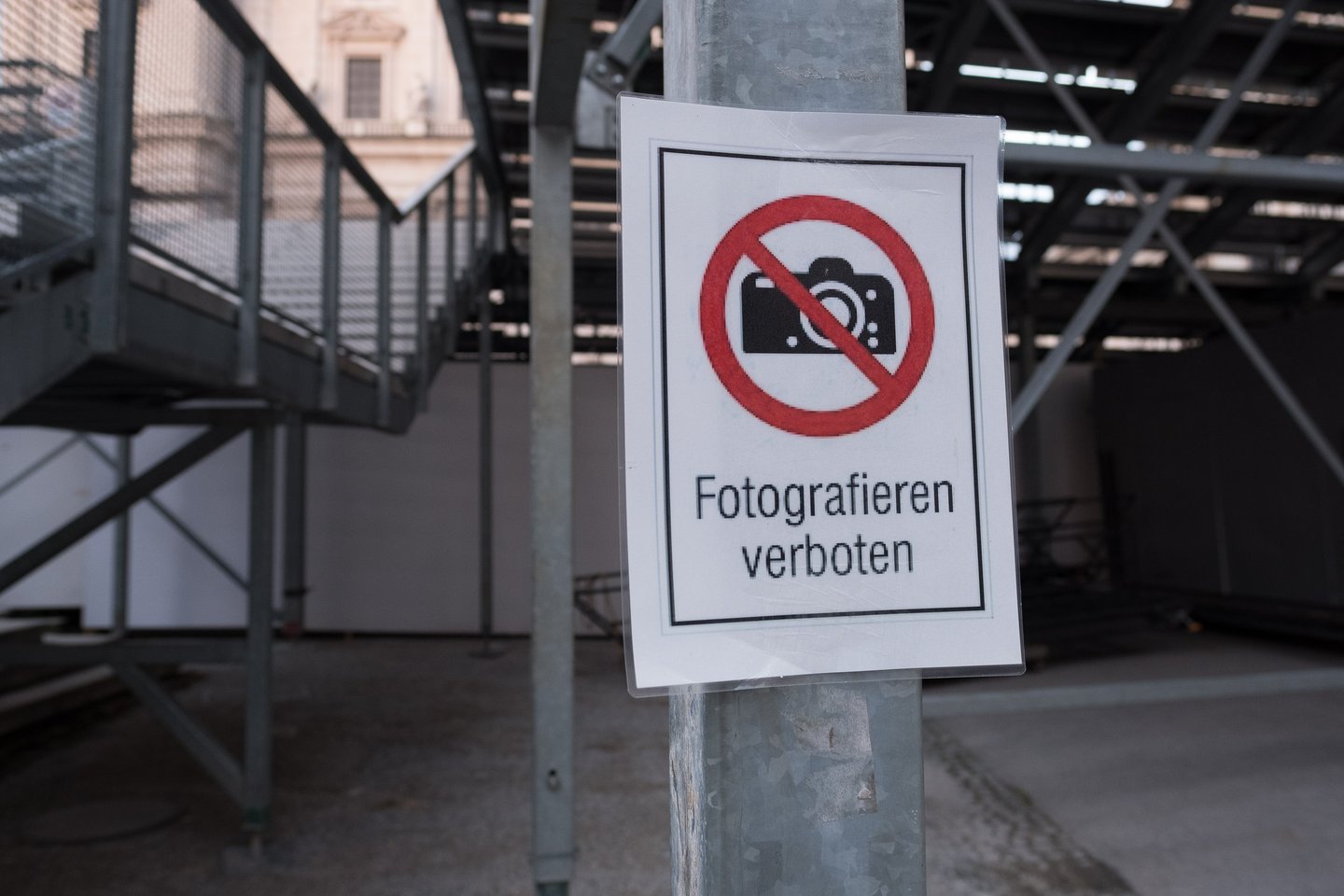 Fotografieren verboten no-photography sign on a metal pole beside the Jedermann grandstand scaffolding at the Salzburg Festival in the Altstadt
