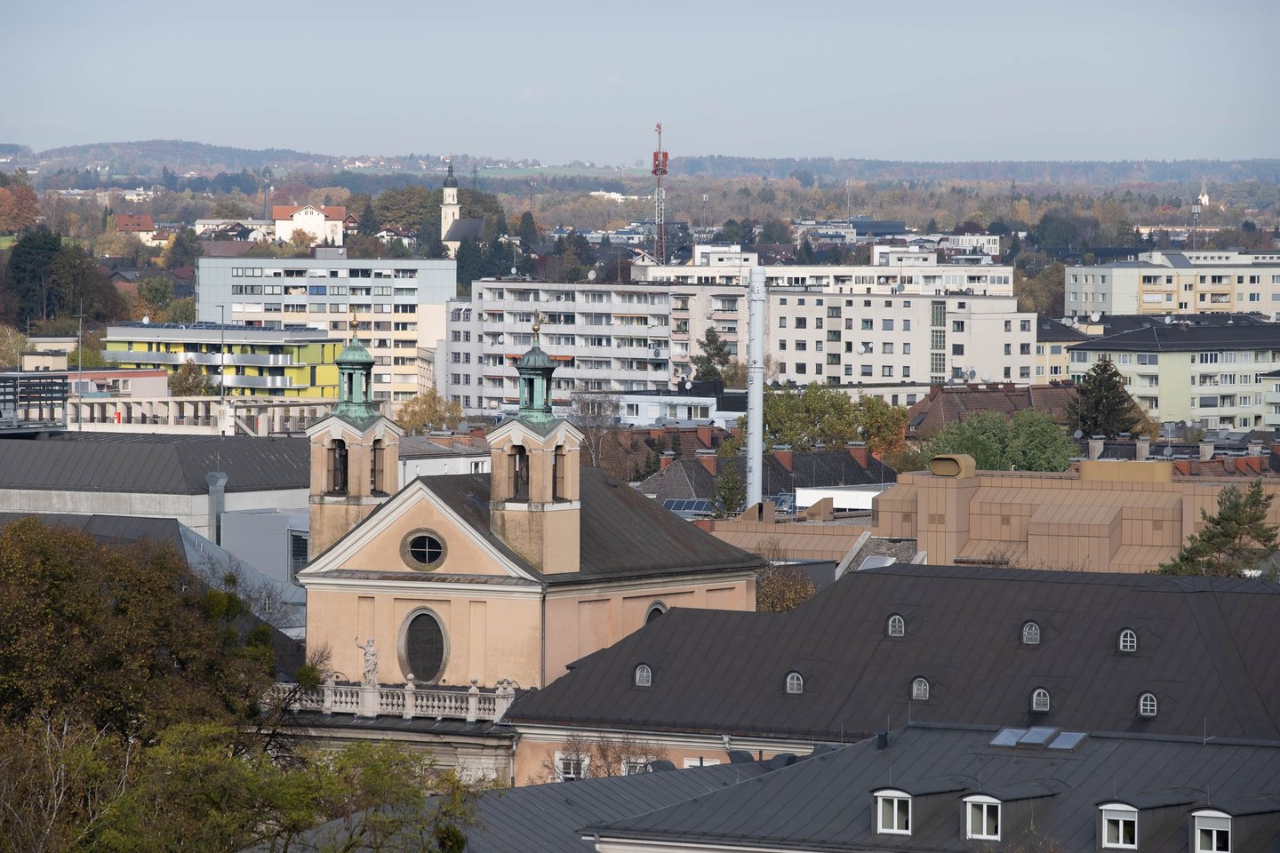 Johannesspital Church viewed from afar across the Salzburg cityscape