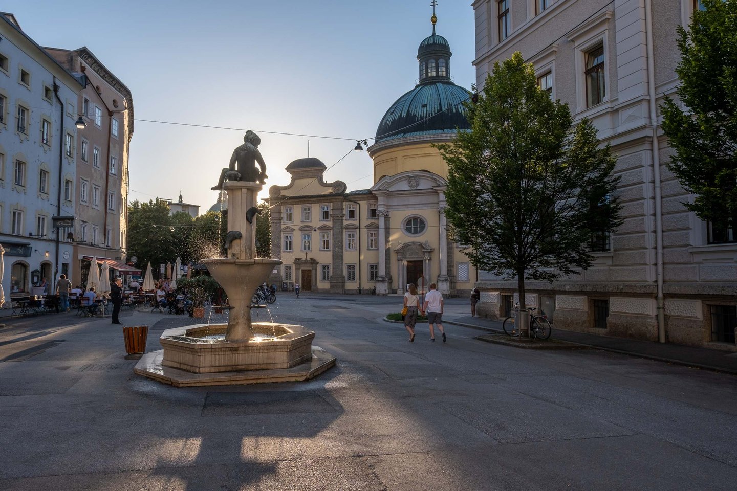Kajetanerplatz square with its fountain and Cajetan Church in the background in Salzburg.