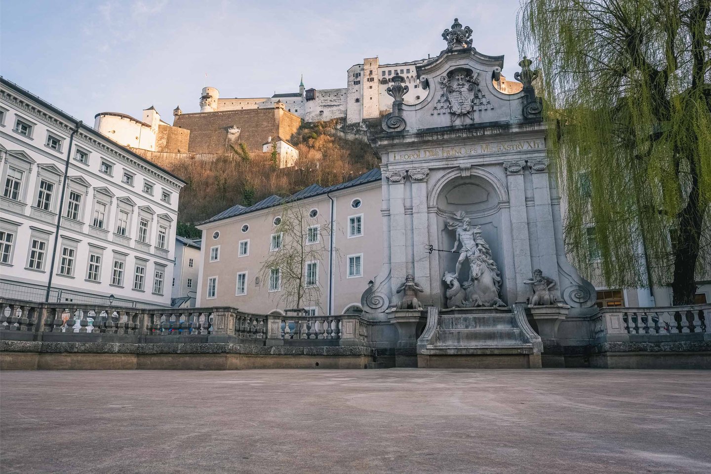 Baroque Kapitelschwemme horse trough fountain on Kapitelplatz below Hohensalzburg Fortress in Salzburg
