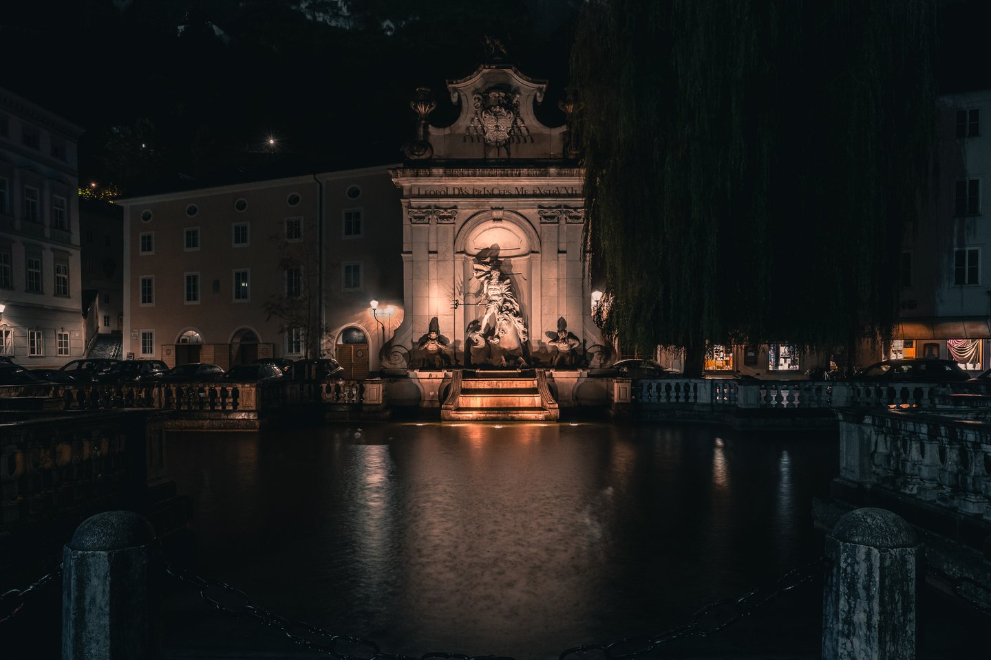 Kapitelschwemme horse pond with Leopold fountain illuminated at night in Salzburg old town