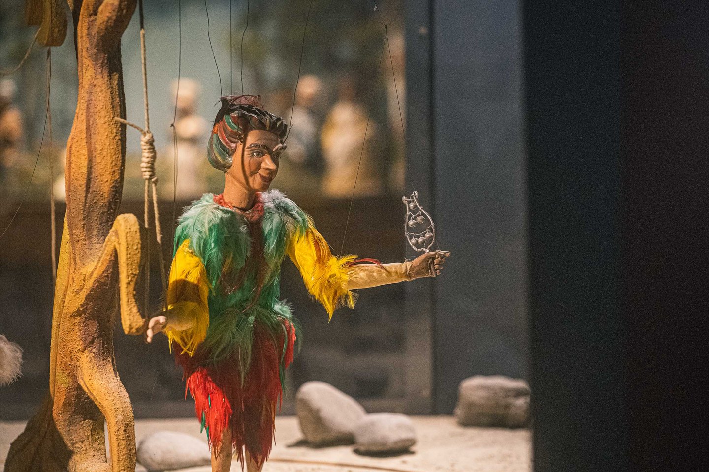 Papageno marionette from Mozarts Magic Flute holding a bird on display at the Marionette Museum Salzburg.