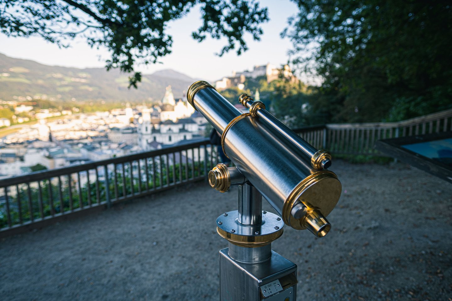Telescope on Moenchsberg with view to Hohensalzburg Fortress in Salzburg
