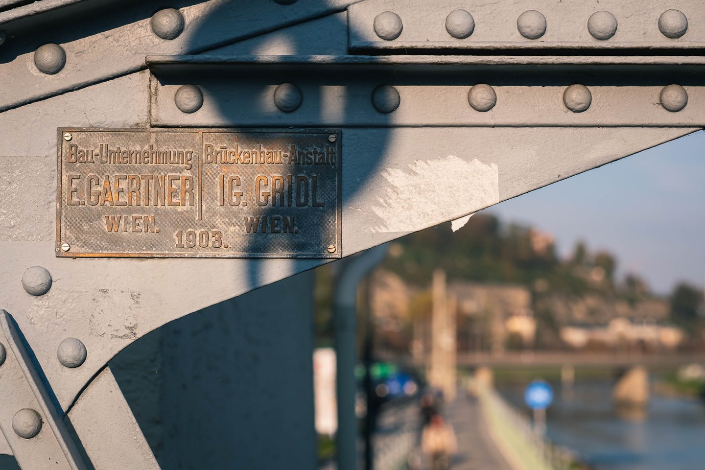 Maker plate on the Mozartsteg iron footbridge over the Salzach in Salzburg.