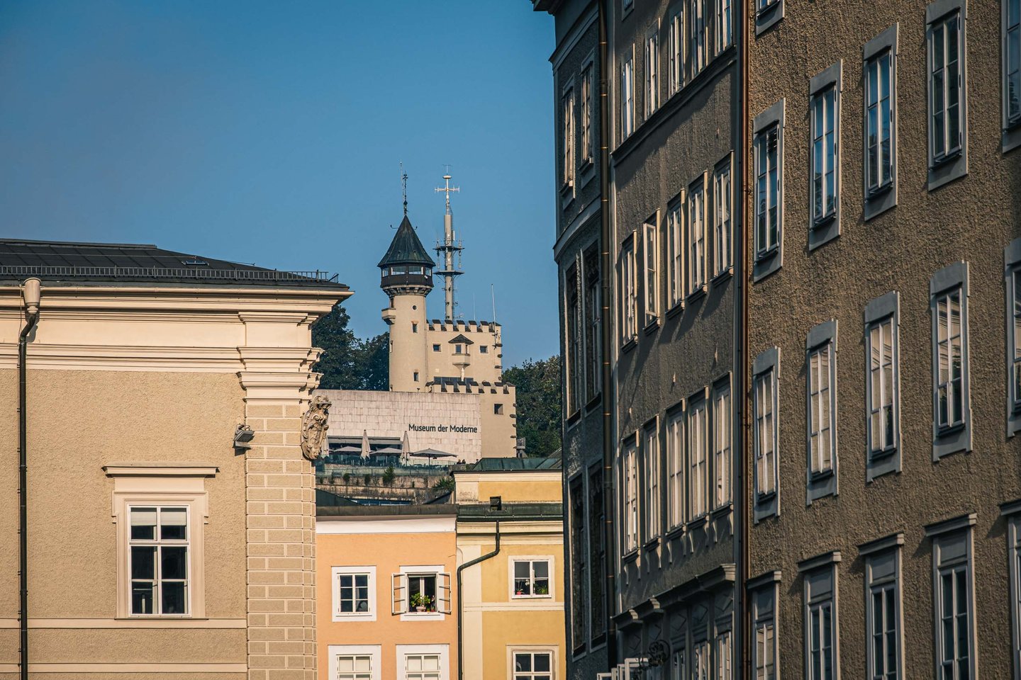 Museum der Moderne tower on Monchsberg seen above Salzburg old town rooftops