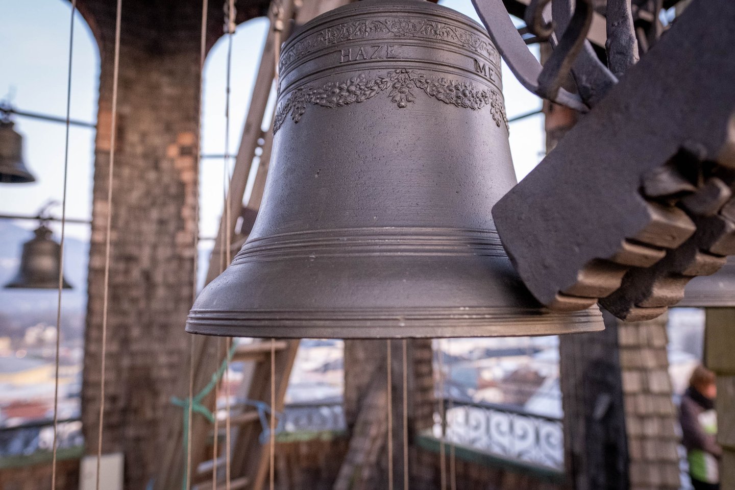 Close-up of bronze carillon bells hanging inside the Glockenspiel tower in Salzburg