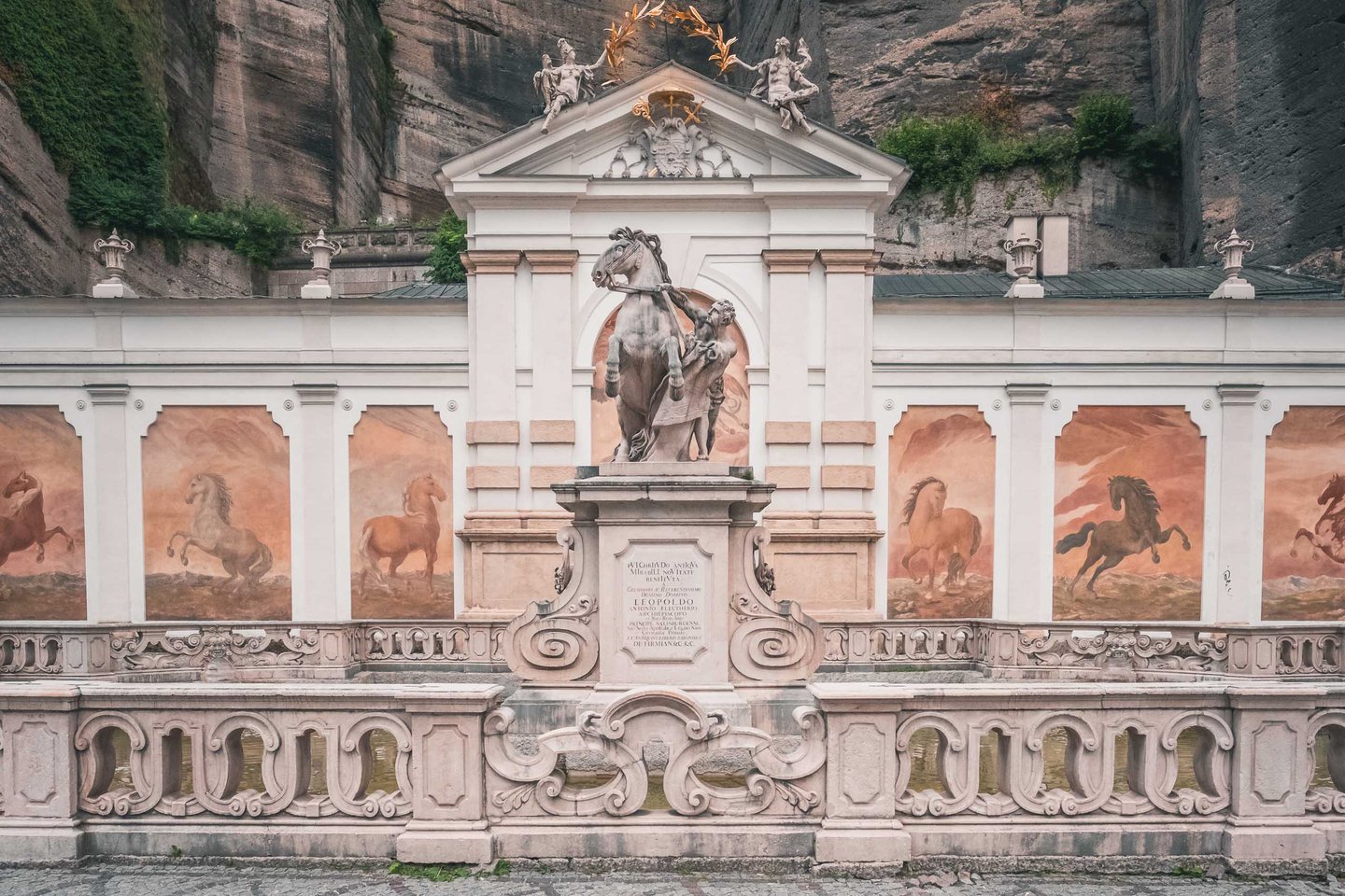 Pferdeschwemme horse pond with rearing horse sculpture and equine frescoes in Salzburg old town