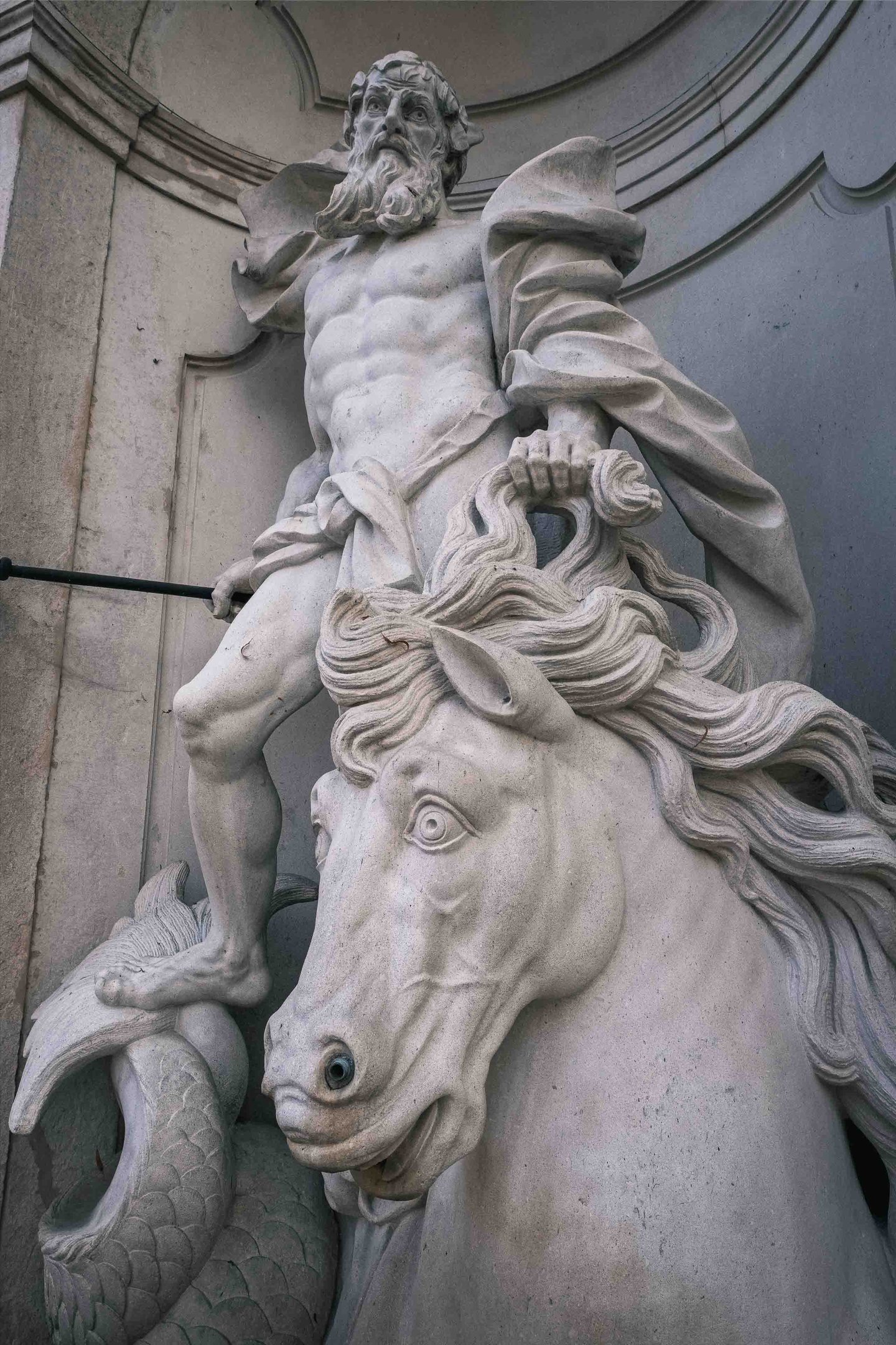 Baroque horse tamer and rearing horse sculpture at Pferdeschwemme in Salzburg old town.