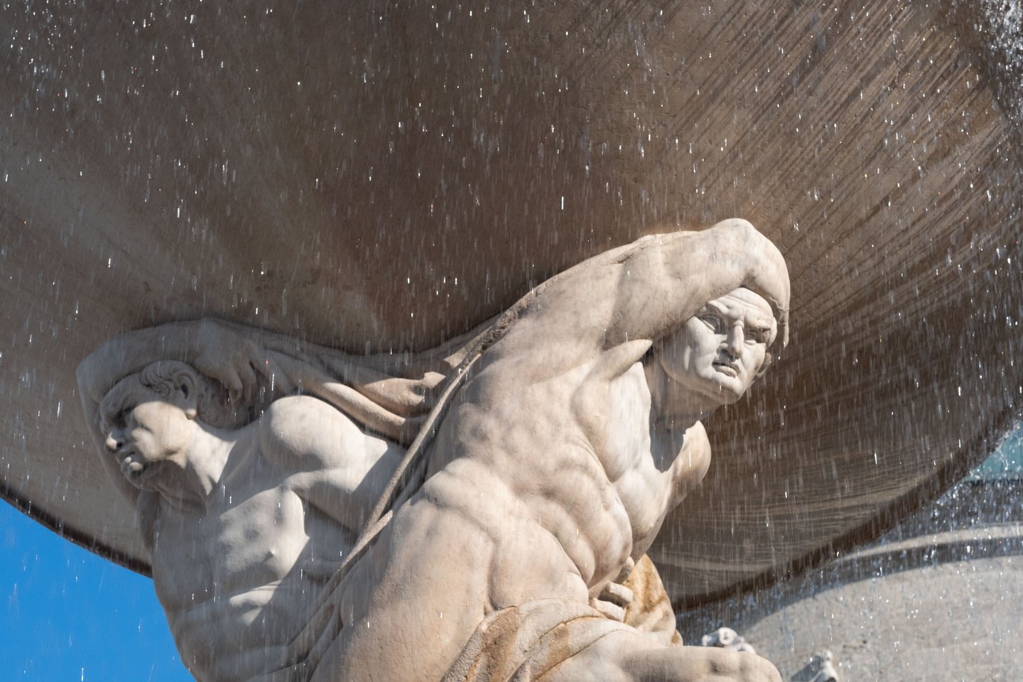 Muscular Atlas figures supporting basin of Residenzbrunnen fountain on Residenzplatz in Salzburg