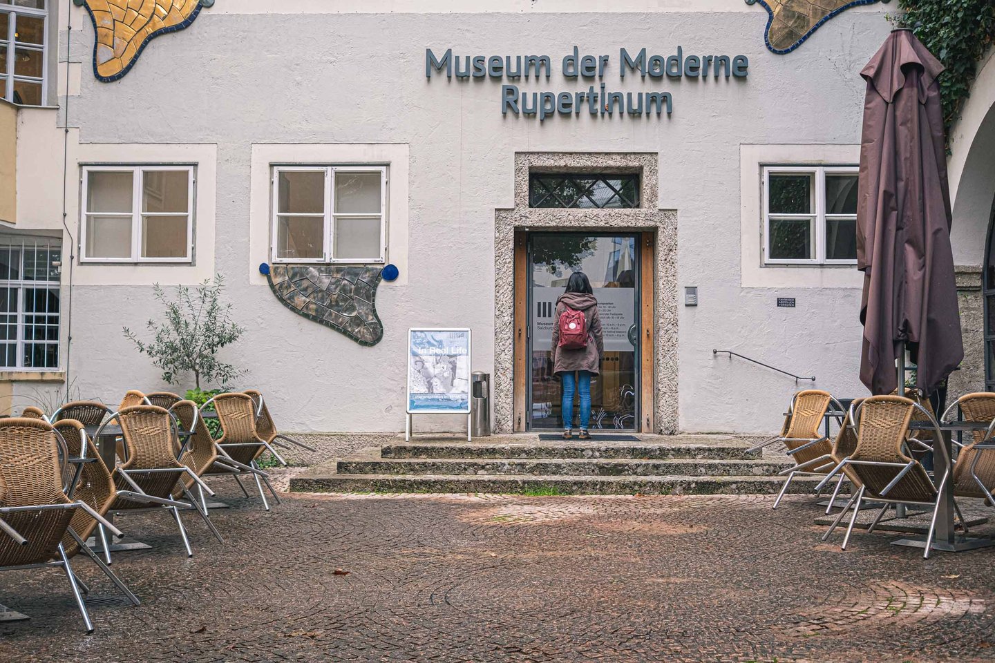 Front facade of the Museum der Moderne Rupertinum with entrance and signage in Salzburg old town.