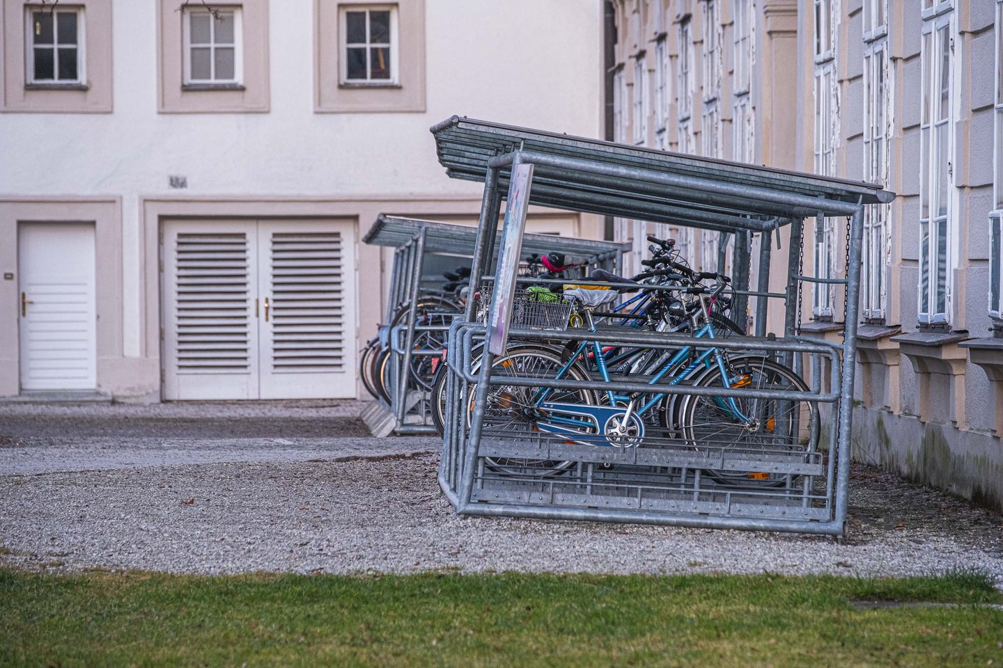 Two-tier bike rack in a Salzburg courtyard used as content asset for articles on Salzburg as a bike-friendly city