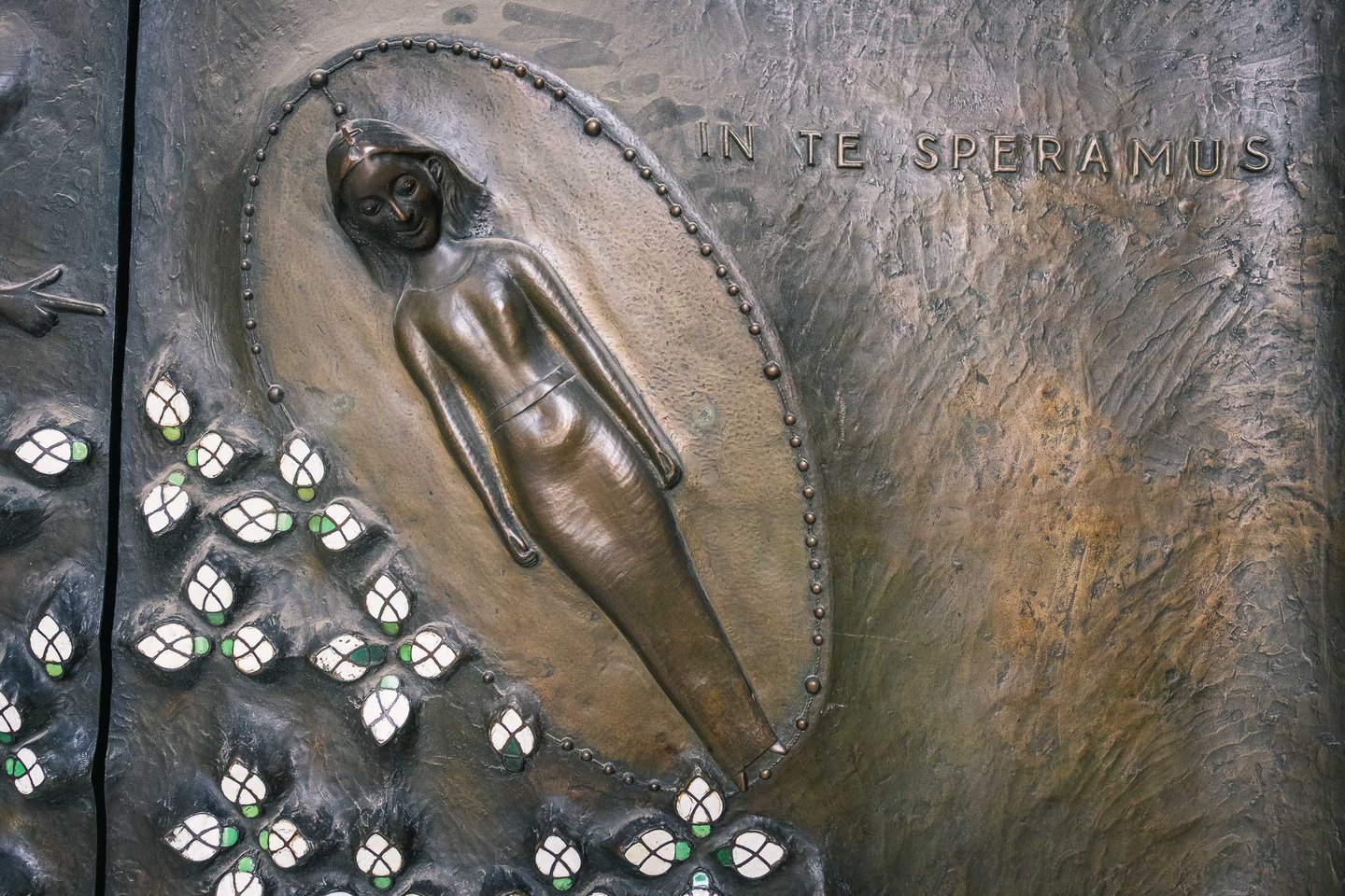 Bronze portal relief with In Te Speramus inscription on Salzburg Cathedral in Salzburg old town