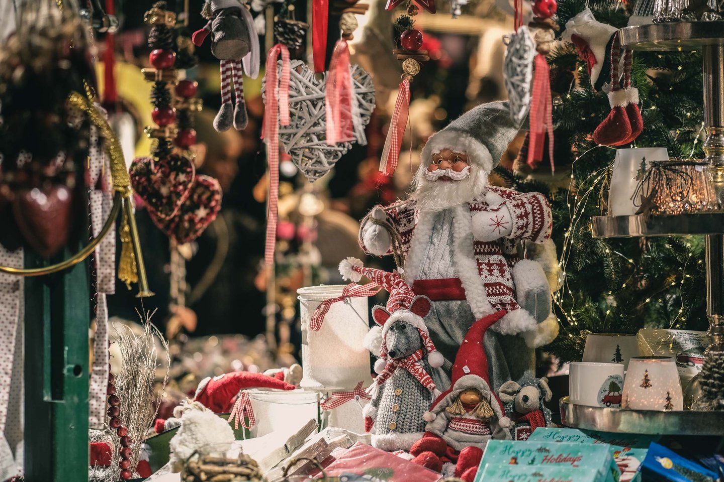 Christmas market stall with Santa figures and ornaments at the Salzburg Christkindlmarkt.