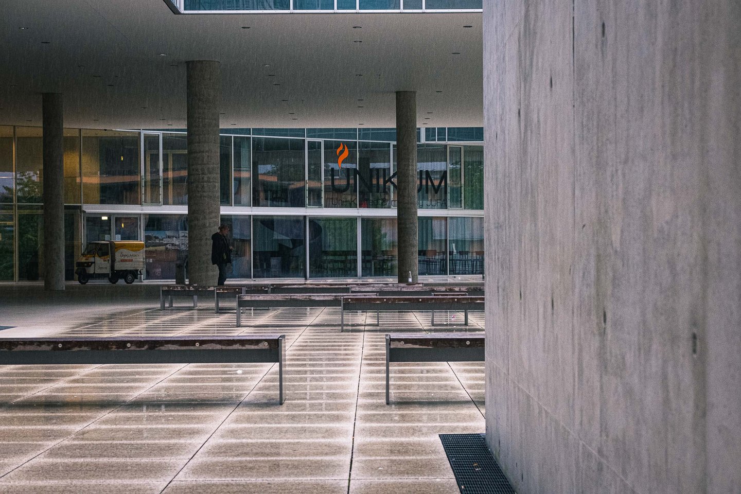Concrete columns and glass facade of the Unipark building in Salzburg Nonntal district