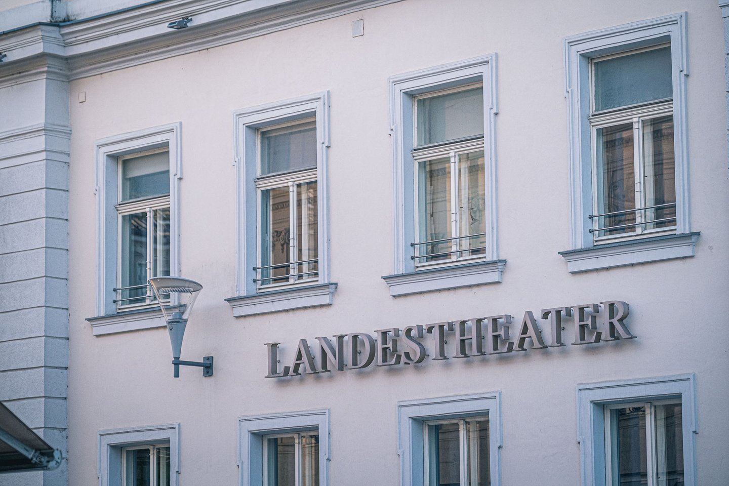 Landestheater signage lettering on the pale facade of the Salzburger Landestheater in Salzburg Neustadt.