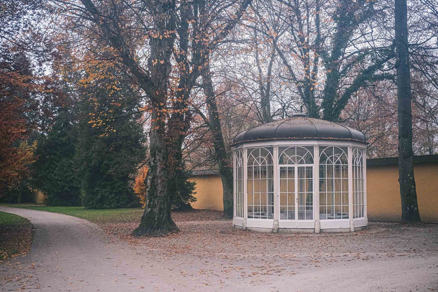 The Sound of Music Pavilion stands among bare autumn trees in Hellbrunn gardens in Salzburg.